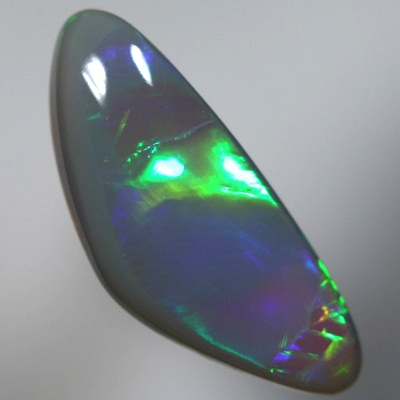 SOLID SEMI BLACK OPAL Large glassy rolling flashes, neon orange to green to purple